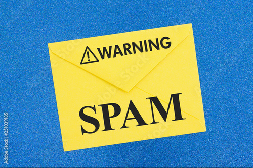 SPAM warning message on white envelope on blue