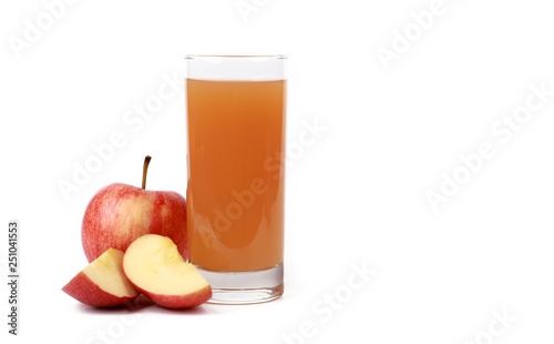 apple juice - sliced ​red apples and a glass of naturally cloudy apple juice in front of white background