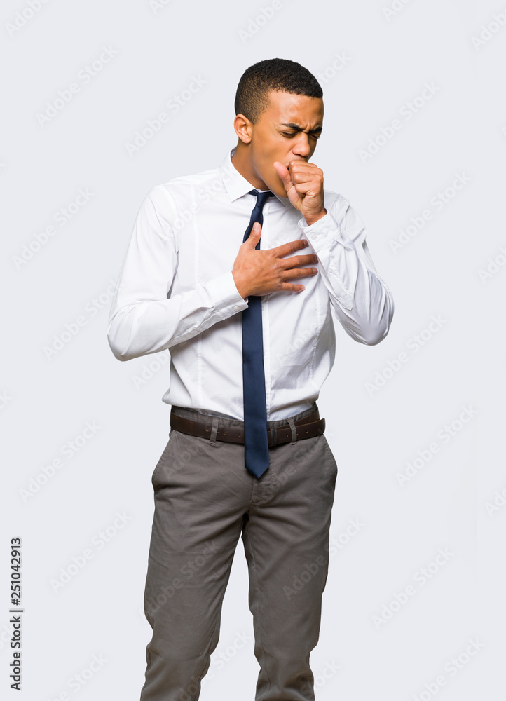 Young afro american businessman is suffering with cough and feeling bad on isolated background Young afro american businessman is suffering with cough and feeling bad on isolated background