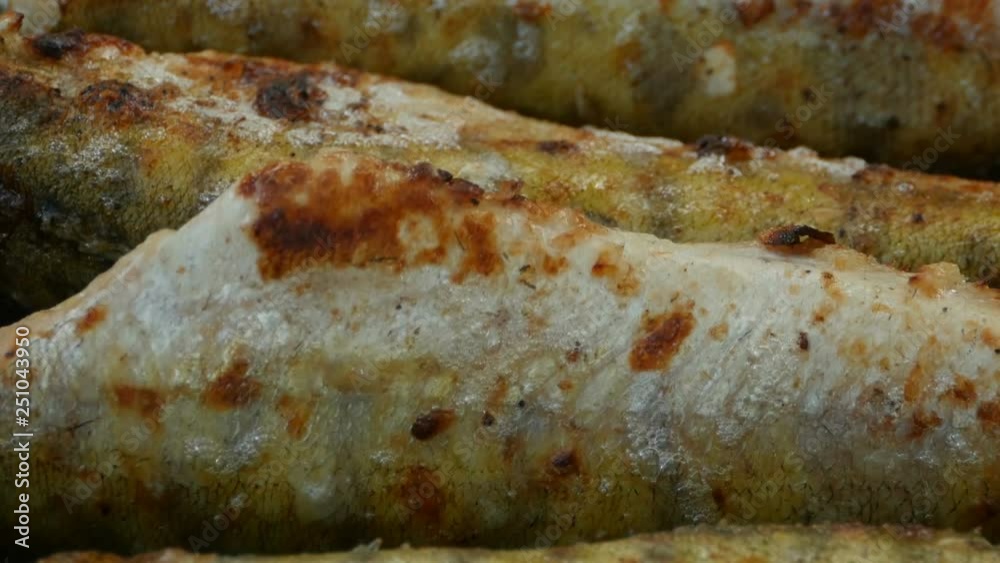 fish grilled on charcoal, close-up fish grilled on charcoal, close-up