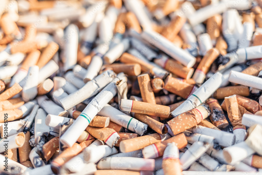 Cigarettes stub or many used tobacco butts with selective focus Cigarettes stub or many used tobacco butts with selective focus