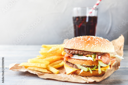 Fototapeta double cheeseburger with fries