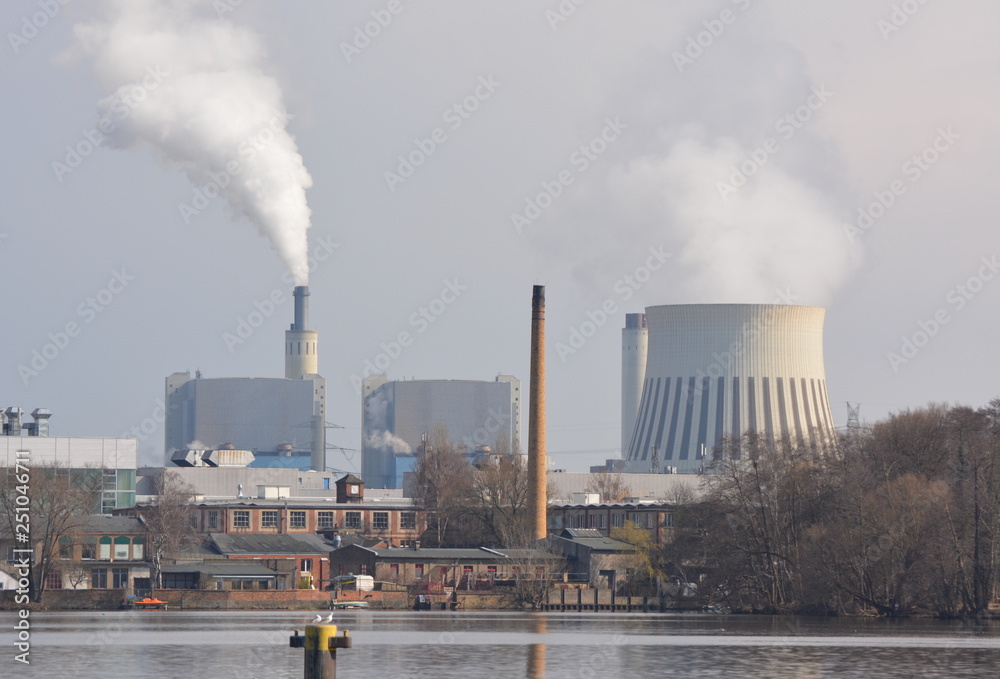 smoke in industrial landscape near a river smoke in industrial landscape near a river