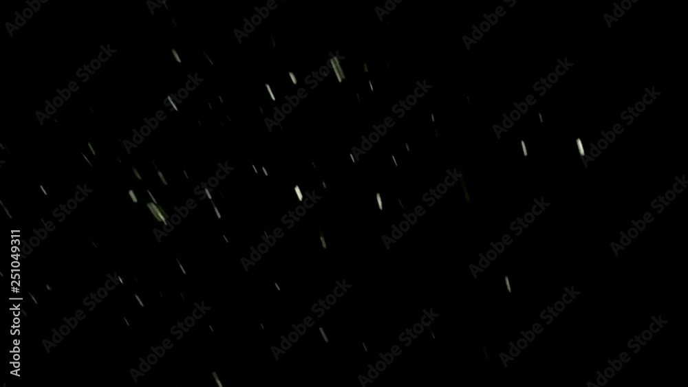 Snowflakes are falling on the night. Abstract moving particles. Snowflakes are falling on the night. Abstract moving particles.
