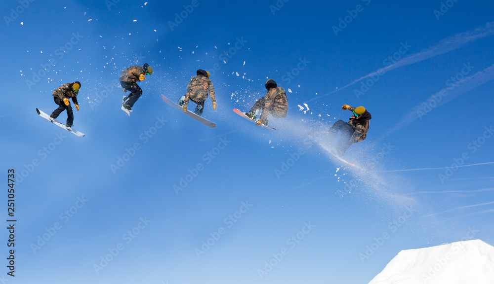 Snowboarding Snowboard Snowboarder at jump mountains at sunny day