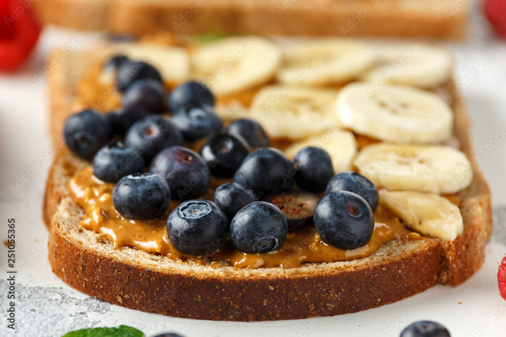 Peanut butter sandwiches with fresh strawberry, blueberry, raspberry and banana whole meal toasts. Peanut butter sandwiches with fresh strawberry, blueberry, raspberry and banana whole meal toasts.