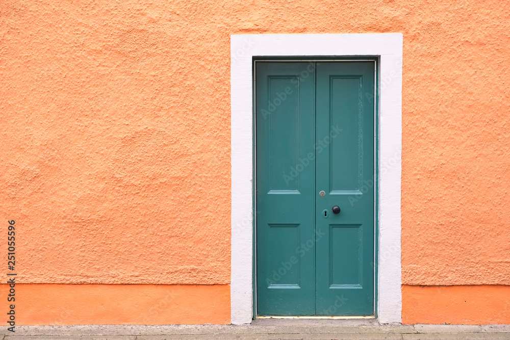  Green old wooden door orange rustic ancient house entrance in Culross