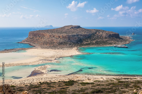 Crete coast, Balos bay, Greece. Amazing sand strand, sea of turquoise and blue colors with the ship. Popular touristic resort. A landscape on a summer sunny day.