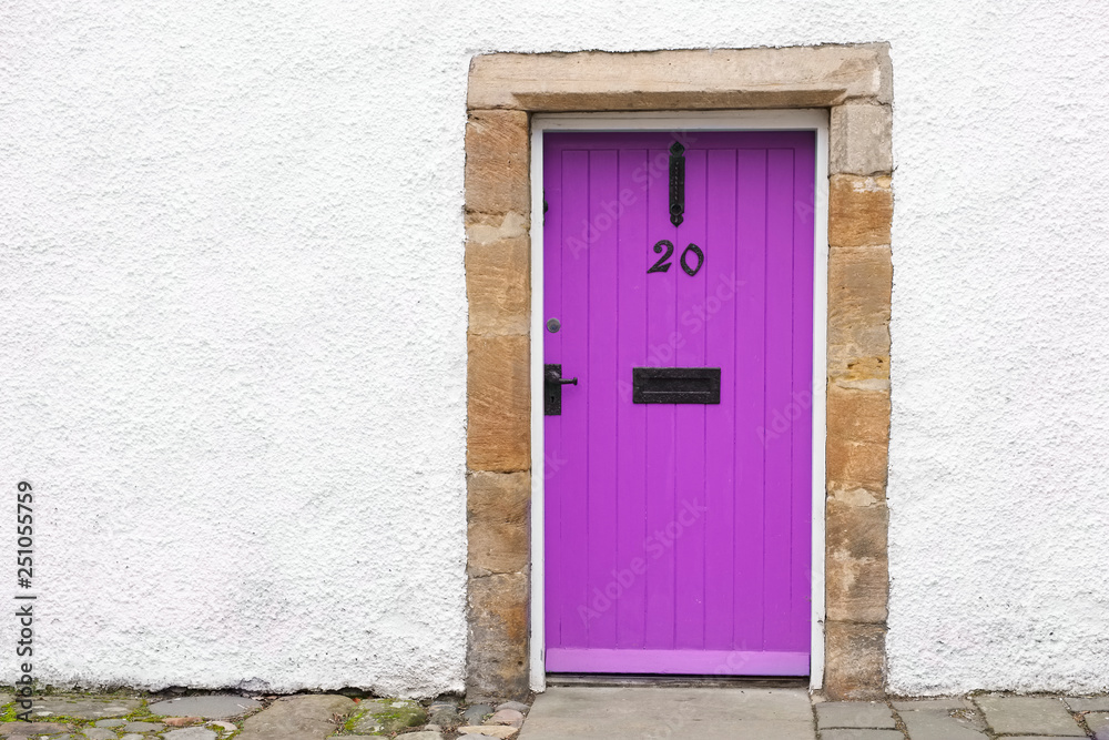  Purple old wooden door rustic ancient house entrance in Culross