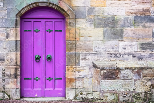  Purple old wooden door rustic ancient house entrance in Culross
