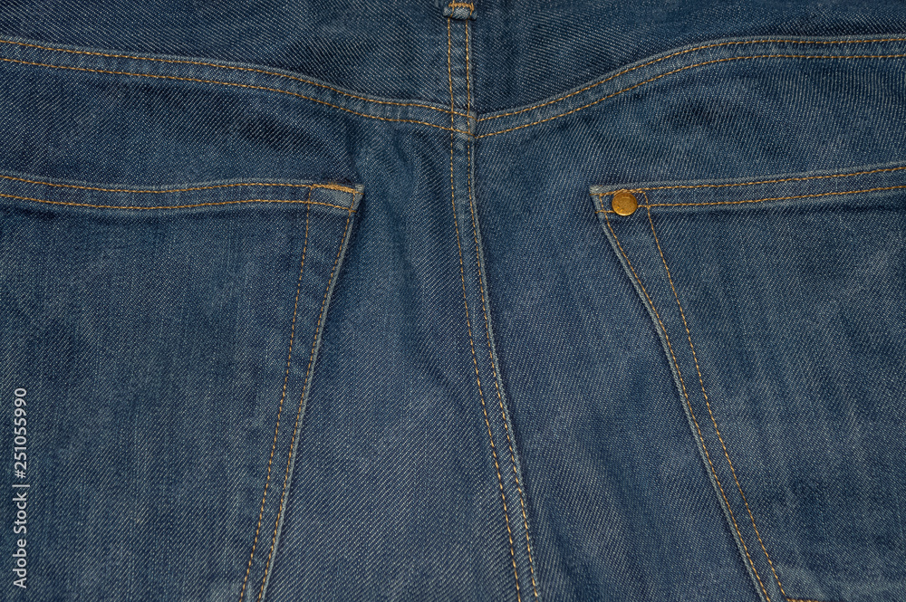 Two back pockets on trendy blue jeans Two back pockets on trendy blue jeans