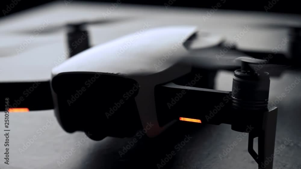 Unrecognizable drone quadcopter with digital camera