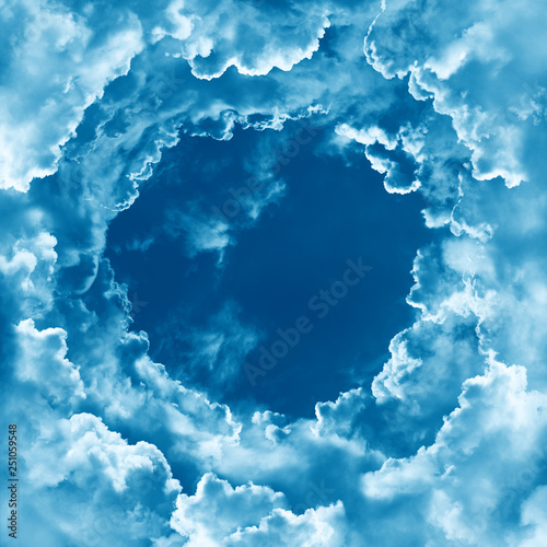 Religion concept heavenly sky background. Sky with beautiful light clouds. Divine shining heaven. Cloudy border  round frame  template. Sunny day. Peaceful nature background