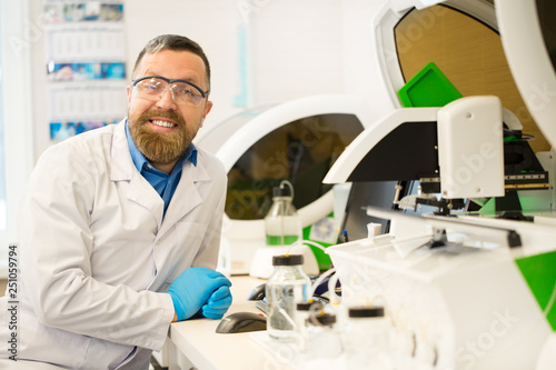 Bearded mature researcher working at the lab