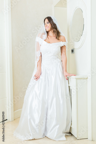 Beautiful young bride in white wedding dress