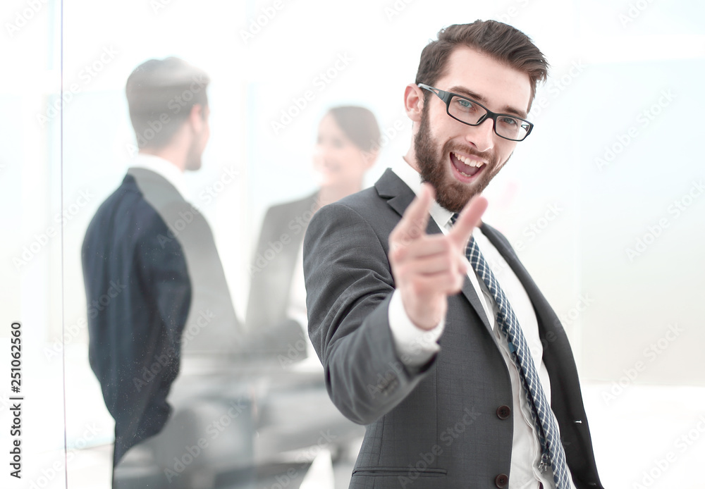 happy businessman pointing at you. happy businessman pointing at you.
