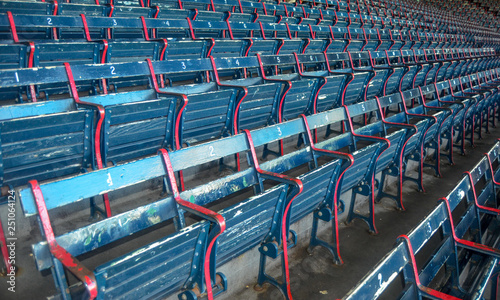 Close up of folded empty Stadium seats, blue and red. 