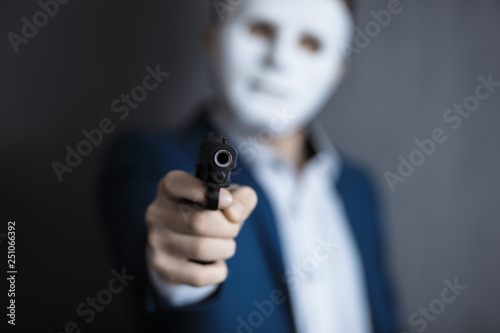 man face mask with hand gun
