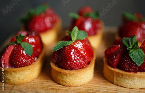 Delicious strawberry cupcakes in Italian cafe photo