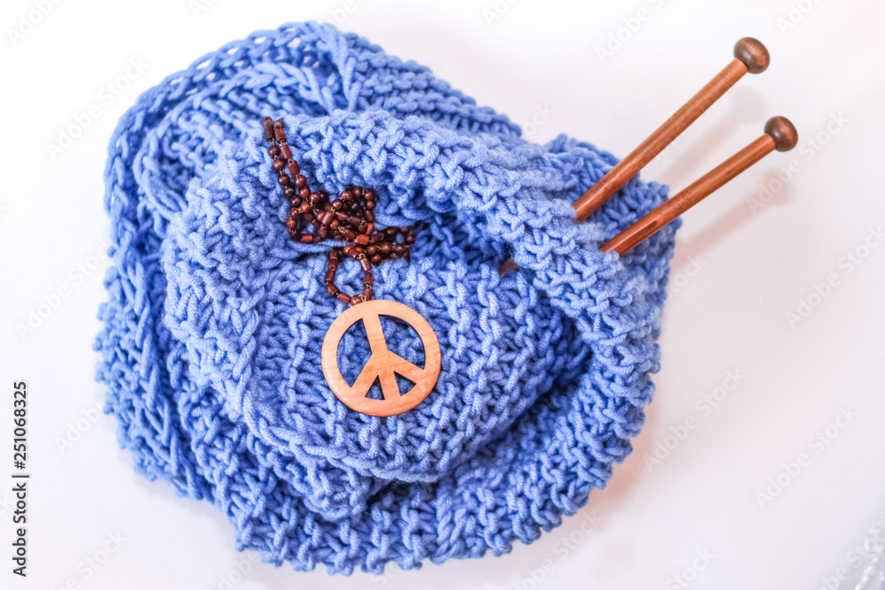 Knitting needles and yarn. Hand made scarf. Wooden pacific.