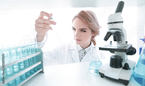 Young woman analyzing samples in a lab