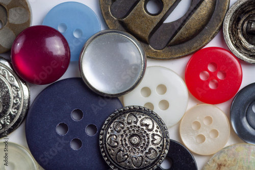 Macro view of buttons and fasteners with assorted colors and textures