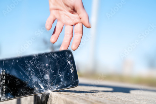 Phone hitting the street hand trying to catch