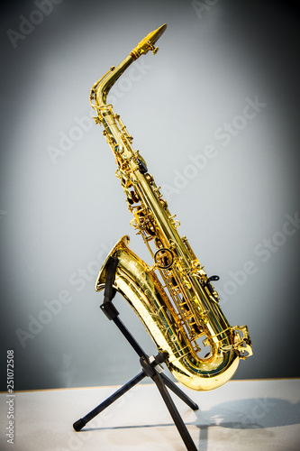 Saxophone on gray background