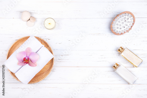 Composition of different spa  beauty and wellness products on white wooden background. 