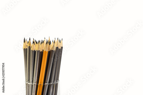 Simple pencils for office workers. Pencils for drawing. Pencils are scattered on a white table and stand in a glass. Simple pencils for schoolchildren and students. For business.