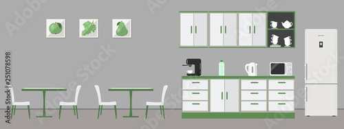 Green office kitchen. Dining room in office. There are kitchen cabinets, tables, chairs, a fridge, microwave, kettle, cups and coffee machine in the image. There are pictures with fruits on the wall