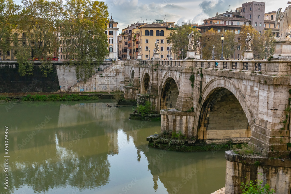 Fototapeta premium Ponte Sant'Angelo, once the Aelian Bridge or Pons Aelius, meaning the Bridge of Hadrian, is a Roman pedestrain bridge in Vatican City, Rome which spans the Tiber River