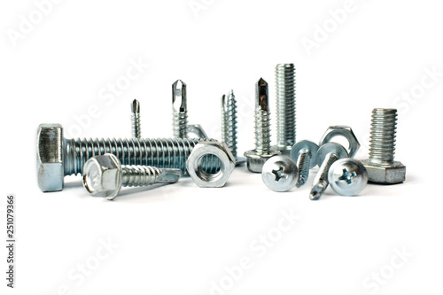 Closeup of different types of fasteners isolated on white. Isolated fasteners. Connecting material on white background