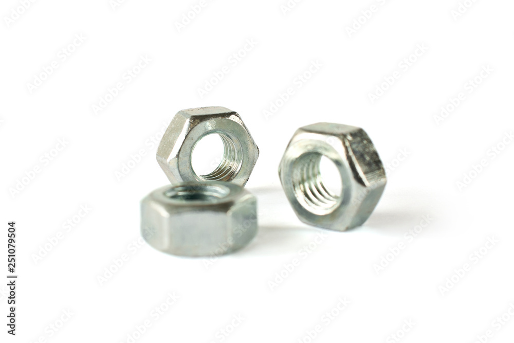 Closeup of nuts isolated on white. Self Drilling screws. Isolated fasteners. Connecting material on white background Closeup of nuts isolated on white. Self Drilling screws. Isolated fasteners. Connecting material on white background