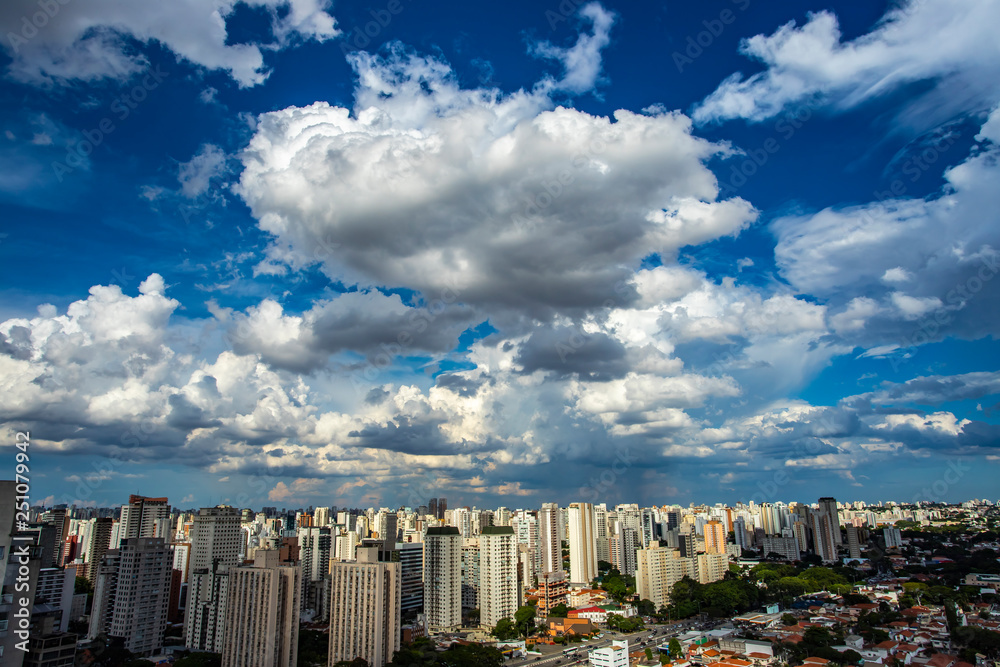 Amazing view over a city, the city of Sao Paulo Brazil. Big White clouds at sky. 