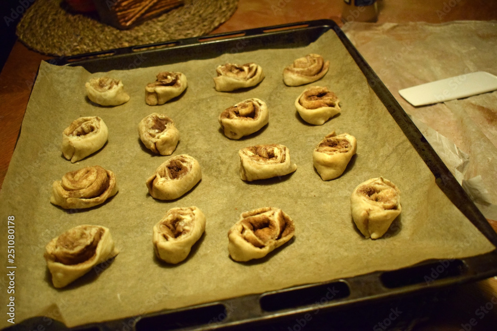 Buns on a baking sheet before baking. Traditional Swedish and Norwegian pastries. Buns on a baking sheet before baking. Traditional Swedish and Norwegian pastries.