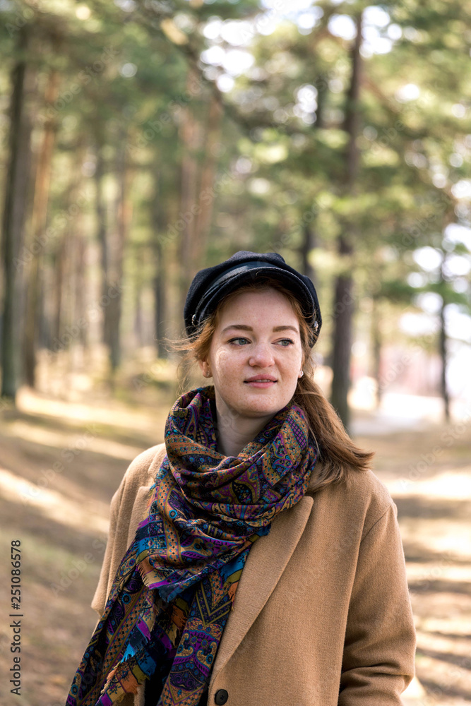 Beautiful girl in a coat runs through the woods. Happiness, freedom, zen concept Beautiful girl in a coat runs through the woods. Happiness, freedom, zen concept
