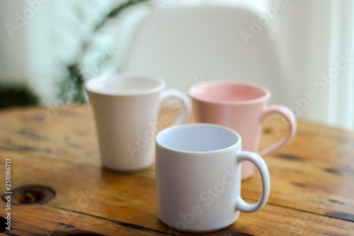 white mugs cups of coffee on wooden table