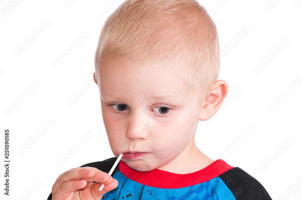 Cute little boy sucking on candy Cute little boy sucking on candy