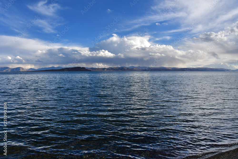 Fototapeta premium China. Great lakes of Tibet. Lake Teri Tashi Namtso in summer evening under a cloudy sky
