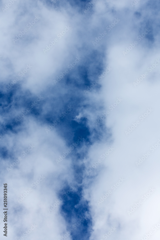 Blue sky covered in large puffy cumulonimbus cloud formations Blue sky covered in large puffy cumulonimbus cloud formations