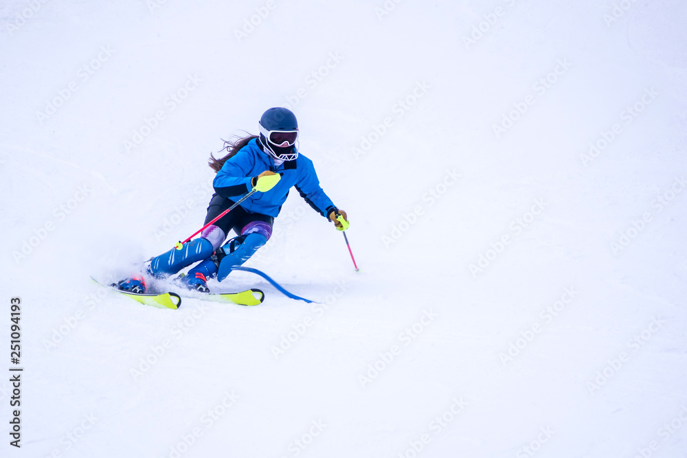People are enjoying downhill skiing and snowboarding People are enjoying downhill skiing and snowboarding
