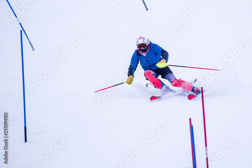 People are enjoying downhill skiing and snowboarding 