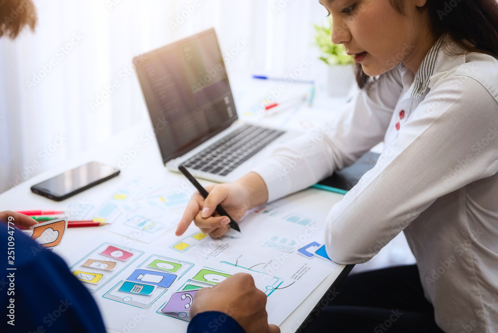 Programmer developing technologies about wireframe application designe of mobile phone. User experience Design concept. Programmer developing technologies about wireframe application designe of mobile phone. User experience Design concept.