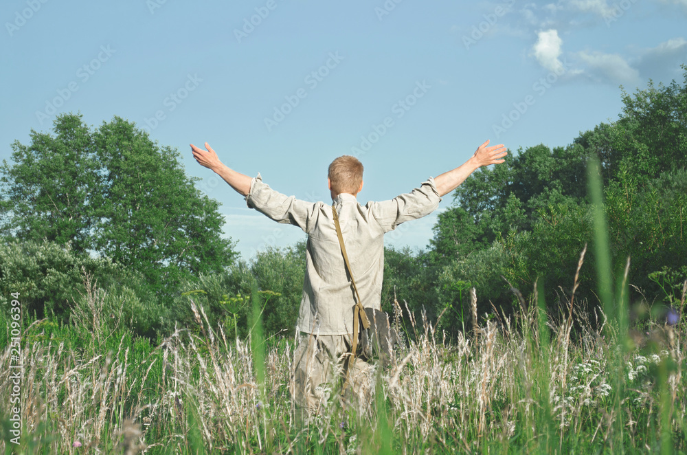 soldier stands in the field with his arms outstretched to meet something soldier stands in the field with his arms outstretched to meet something