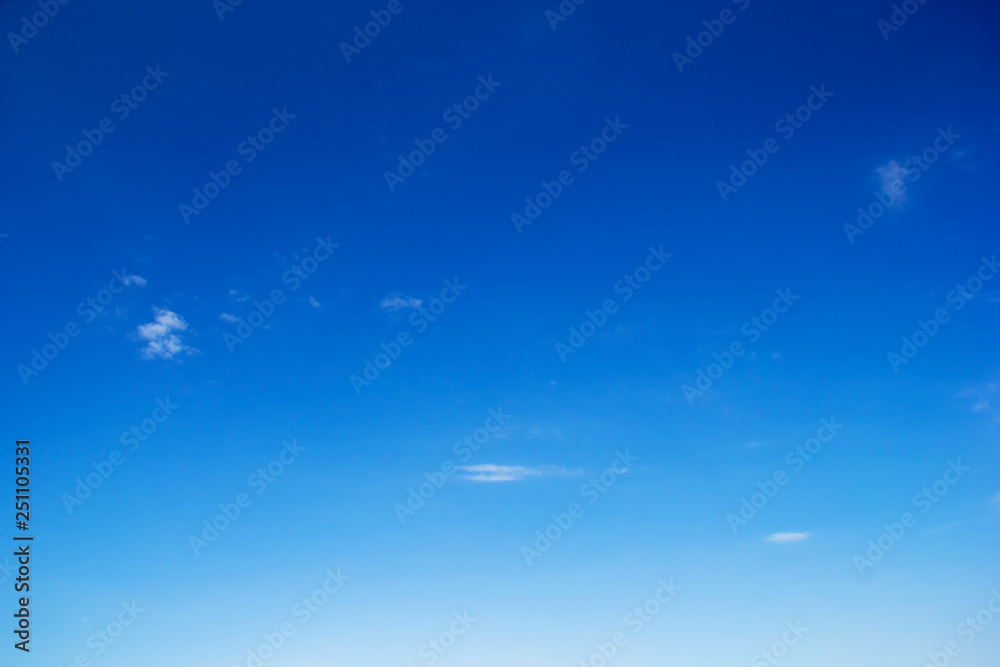 Fototapeta premium Blue sky background and white clouds soft focus, and copy space