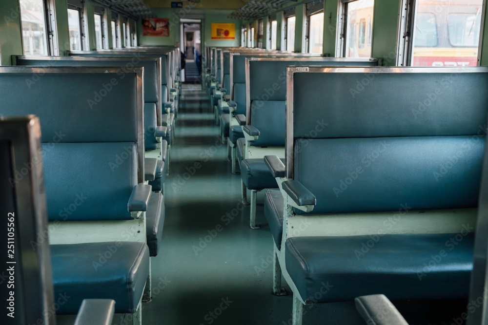 Obraz premium Seat on the old train with evening sun.