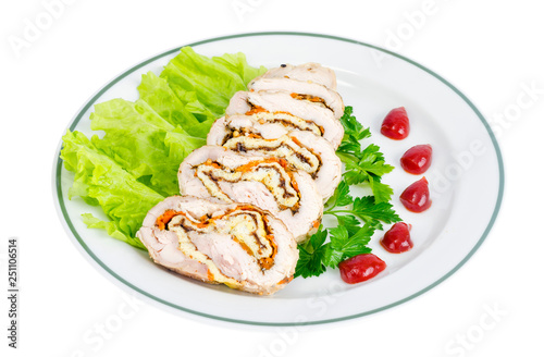 Plate of lettuce and slices of chicken roll.