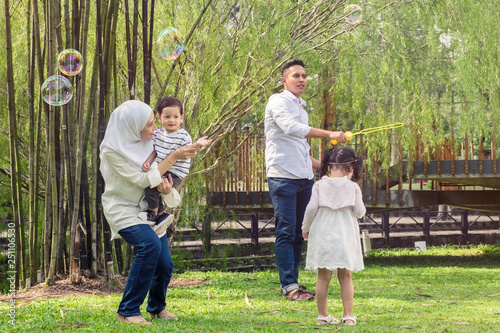 happy family concept with enjoying expression face,having fun at public park.