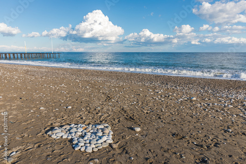 the stones are laid out in the shape of a heart and a beach near Kemer, Turkey photo